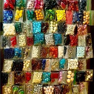 HUGE assortment of Beads! Approx 100 small bags of beads in various colors.